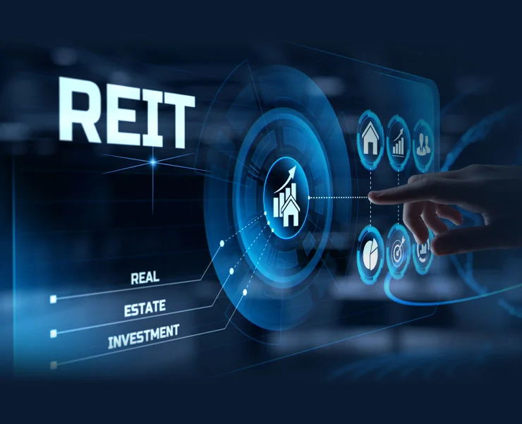 Digital interface with the text 'REIT' and icons representing real estate investment, with a hand interacting with the display.