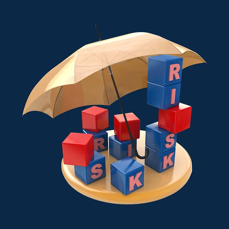 Blocks spelling "RISK" under a large umbrella on a dark blue background.