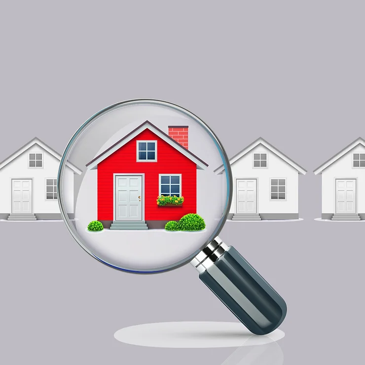 Magnifying glass focusing on a red house among a row of identical white houses, highlighting property selection or real estate.